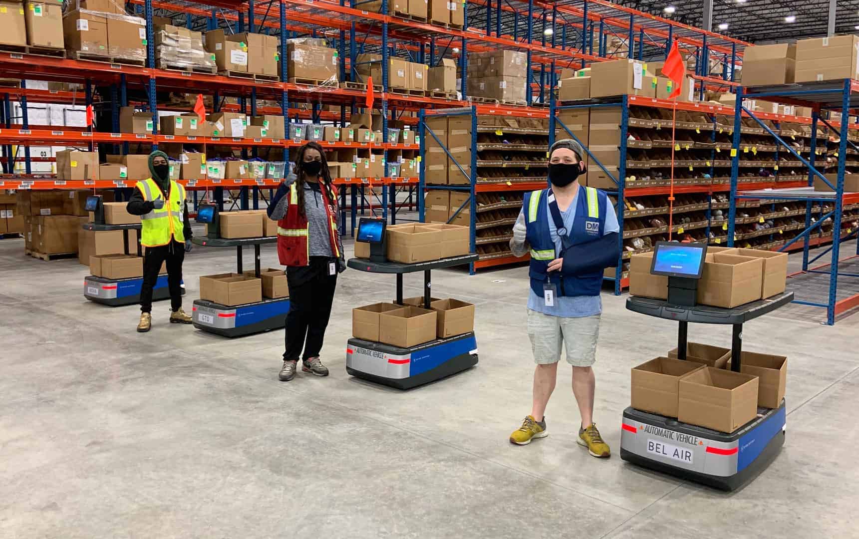 A team of warehouse associates preparing to pick for the day.