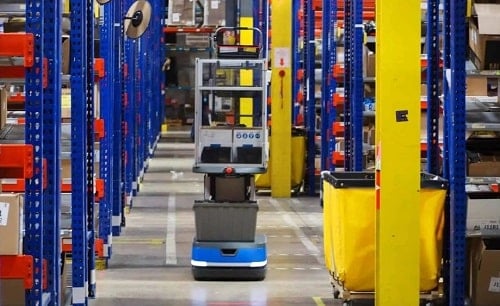 6 River Systems' autonomous mobile robot in a warehouse aisle