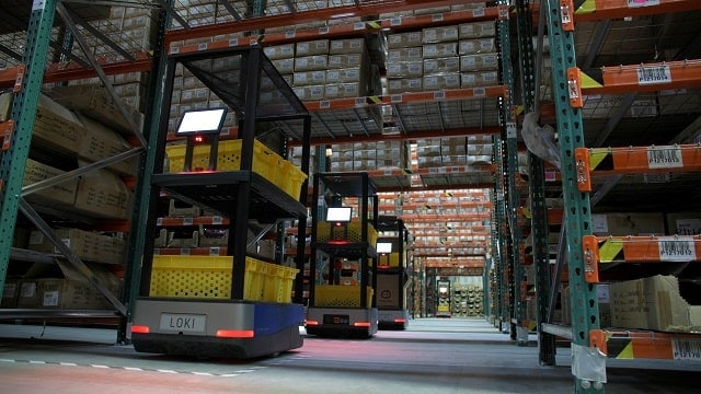 Autonomous mobile robots (Chucks) in a warehouse aisle